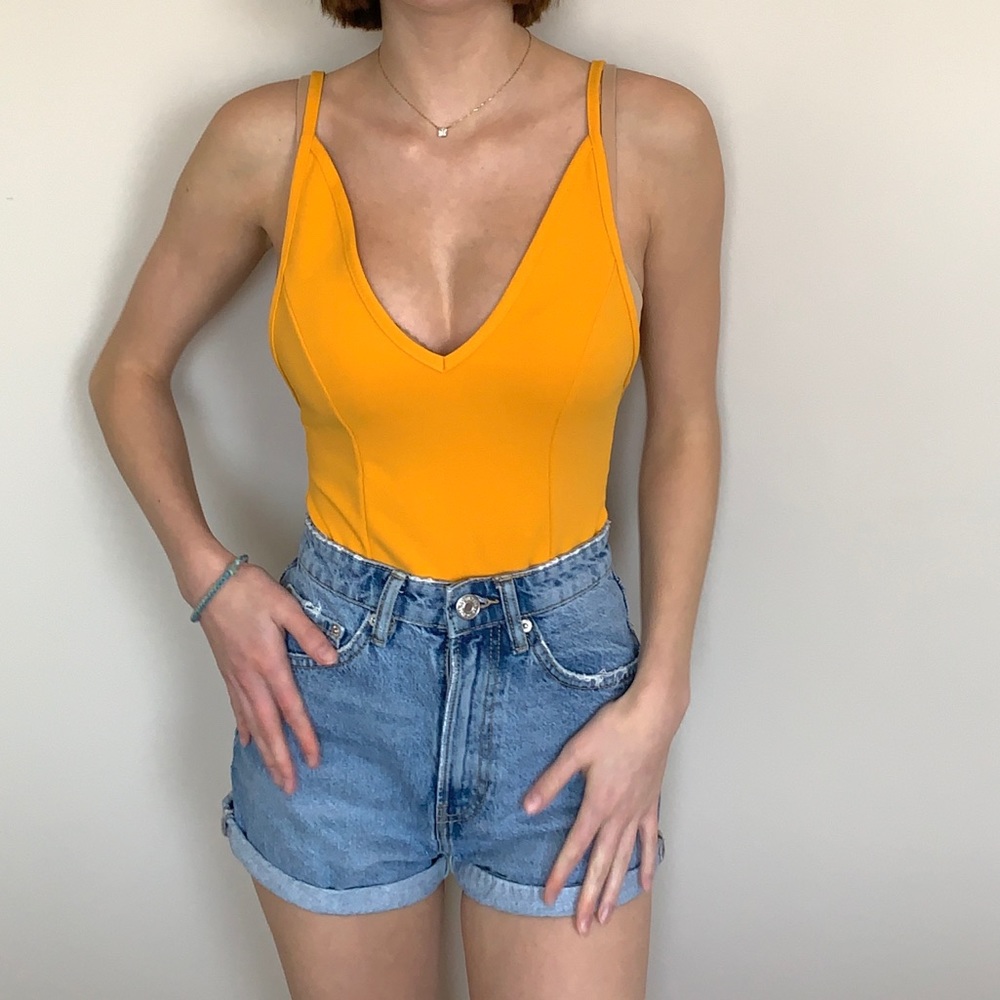 Yellow bodysuit